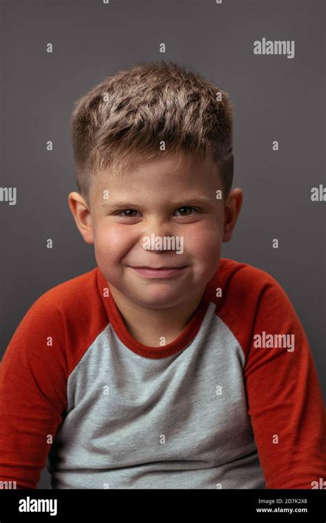 Preschool Boy Smiling With Smirk At Camera Portrait Of Funny Child On