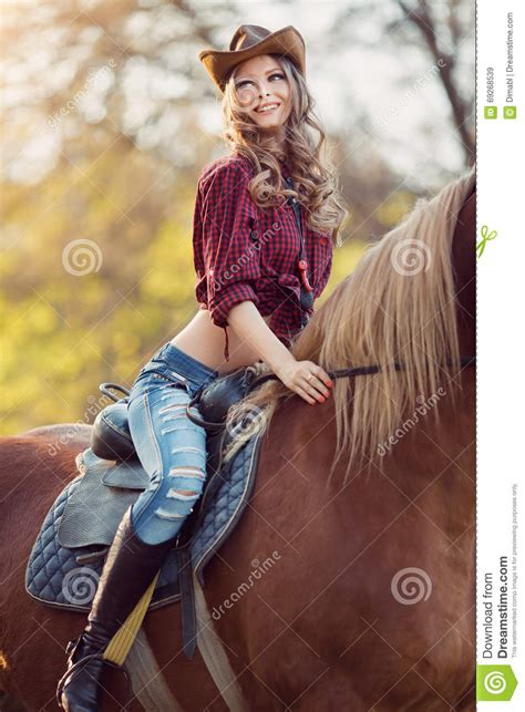 Beautiful Smiling Girl Riding Horse On Autumn Field Stock