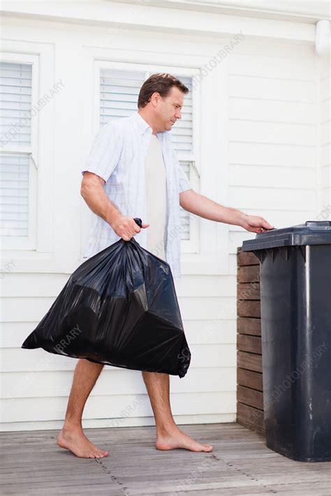 Man Taking Out Garbage Stock Image F0053142 Science Photo Library