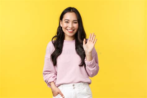 lifestyle emotions and advertisement concept cute stylish asian girlfriend waving hand to say