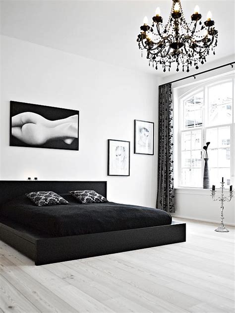The head of the white traditional bed is inserted into a cozy alcove at the black wall formed by hanging cabinets with a silvery mirror face paired with two welcome to our white primary bedroom photo gallery showcasing dozens of white bedroom ideas of all types including small, large, minimalist. Black And White Bedroom Interior Design Ideas