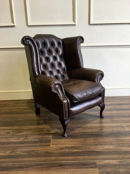 Upholstered dining chairs are a comfortable option for making a dining space extra inviting. Chesterfield Wing Back Chair In Chocolate - Robinson of ...