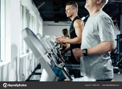 Sportsmen Training On Treadmills — Stock Photo © Arturverkhovetskiy