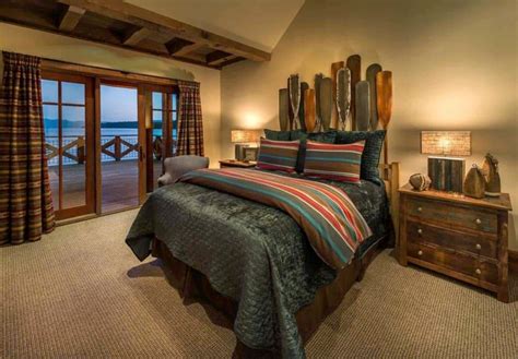 A Bedroom With A Bed Dresser And Sliding Glass Doors Leading To The