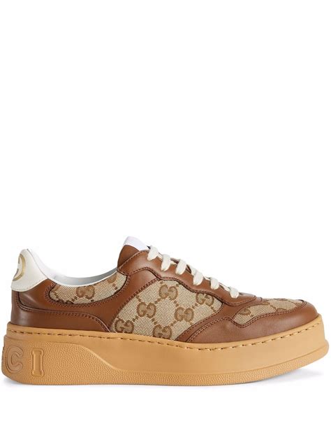 Gucci Gg Embossed Low Top Sneakers Farfetch