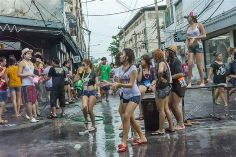 wild songkran with sexy woman dancing and playing on the street in bangkok thailand stock