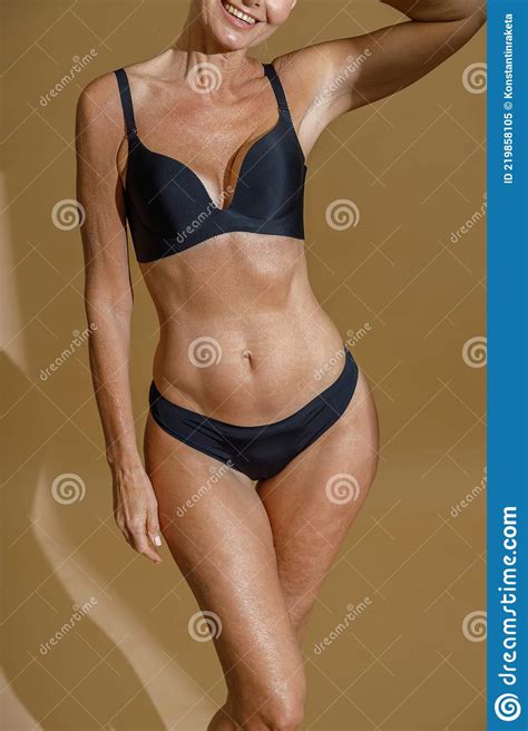 Cropped Shot Of Perfect Fit Body Of Mature Woman Posing Half Naked In