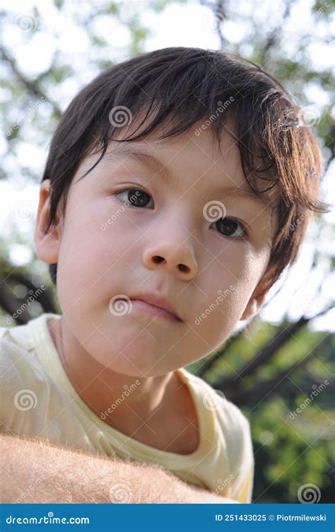 Portrait Of A Young Boy With Beautiful Eyes In Summer Stock Image