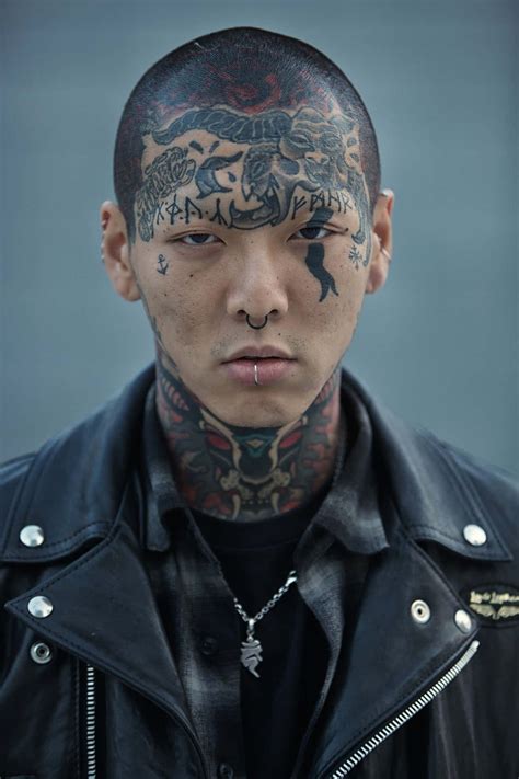 Download A Man With Tattoos On His Face