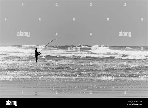 Fisherman On The Beach Of Le Porge Near Lacanau On The French Atlantic Coast Stock Photo Alamy