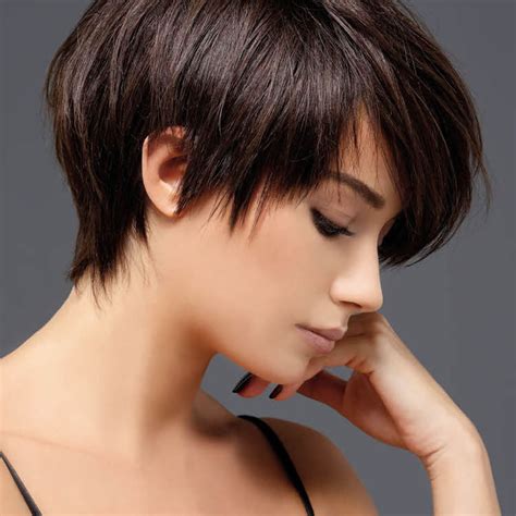 Textured tousled pixie cut with long asymmetrical side swept bangs on warm golden. Pixie Haircuts 2020 - Hair Colors