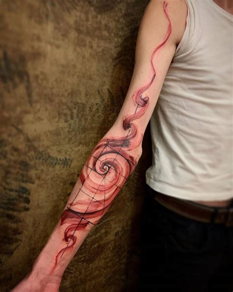 Golden Spiral Tattoo On Arm