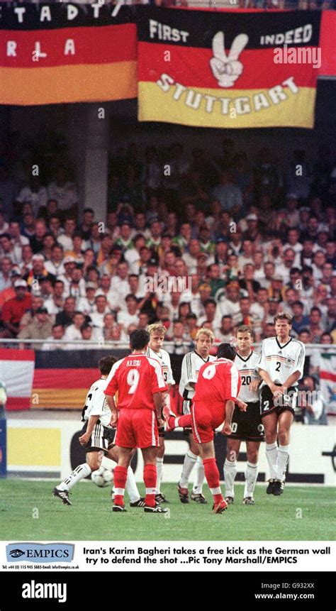Irans Karim Bagheri Right Takes A Free Kick As The German Wall Try