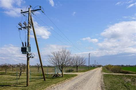 Wooden Power Line Pole With Electric Transformer In Rural Area Stock