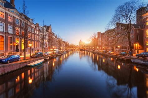 Colorful Cityscape At Sunset In Amsterdam Netherlands Stock Image