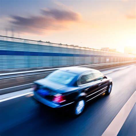 Car Driving On Freeway At Sunset Motion Blur — Stock Photo © 06photo