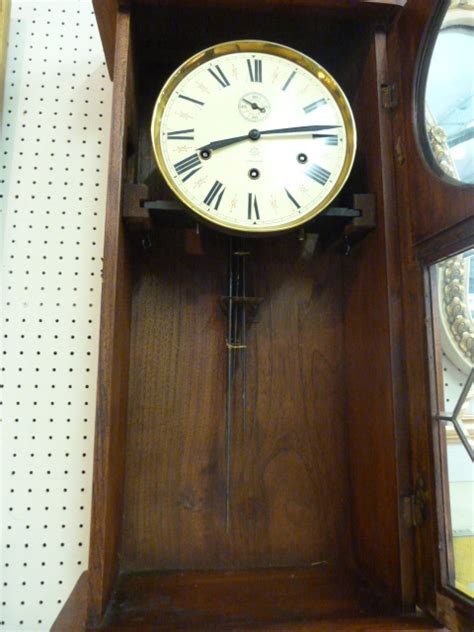 german 8 day wall clock with westminster chimes oak case and junghans movement pendulum and key i