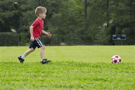 Mixed Race Boy Playing Soccer Soccer Drills For Kids Soccer Training