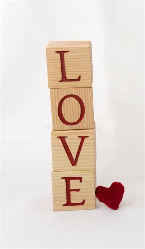 Love Written In Wooden Blocks Text On Wooden Cubes Vertical Image