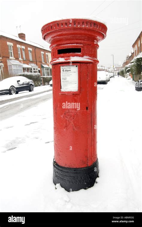 A Red British Post Box Surrounded By Snow In Birmingham Stock Photo Alamy