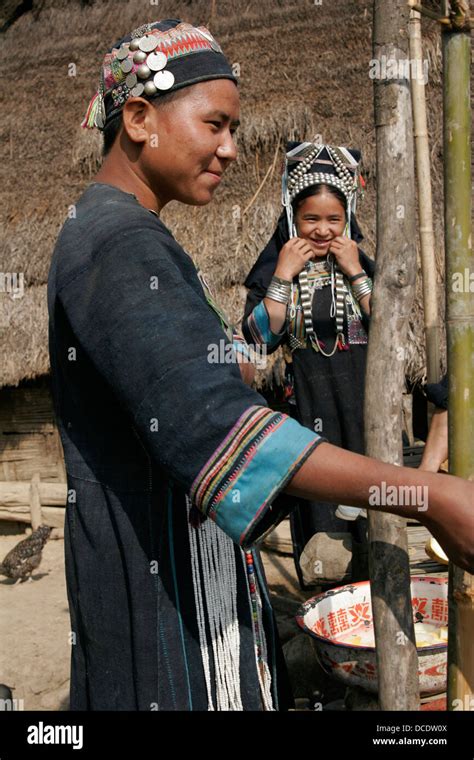 Ethnic Akha Women In Tribal Village Near Phongsali Laos Stock Photo