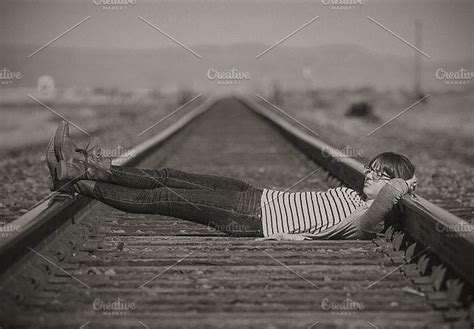 Young Girl Laying On A Railway Against Summer Landscape Hoodoo Wallpaper