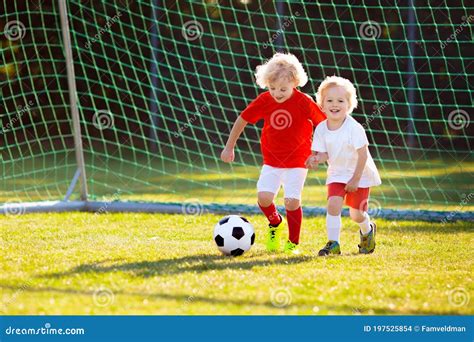 Kids Play Football Child At Soccer Field Stock Photo Image Of Little