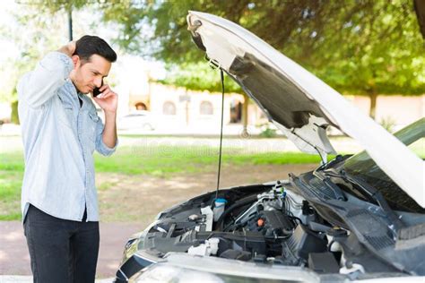 Good Looking Guy Trying To Fix His Broken Down Car Stock Photo Image