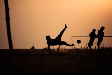 30 Action Packed Photos Of People Playing Footballsoccer At Sunset 500px