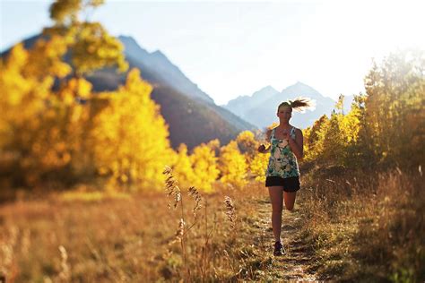A Young Woman Trail Running In The Fall Photograph By Patrick Orton