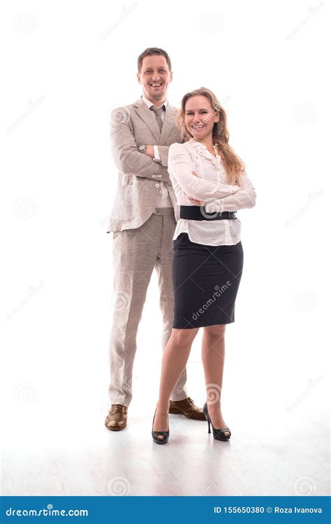 Two Young Employees Or A Businessman A Man And A Woman Confidently