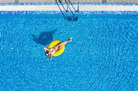 Beautiful Woman In Swimming Pool Aerial Top View From Above Young Girl In Bikini Relaxes And