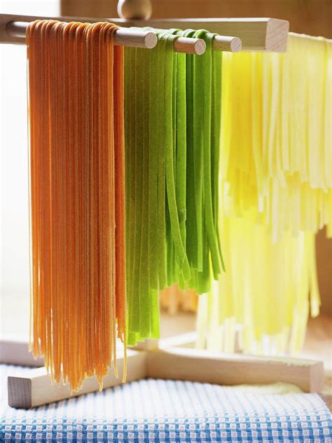 Coloured Pasta Hanging Up To Dry Photograph By Foodcollection Fine