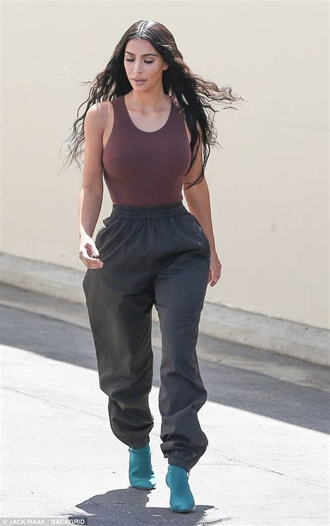 kim kardashian works her hourglass figure in skin tight bodysuit daily mail online