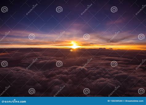 Amazing And Beautiful Sunset Above The Clouds With Dramatic Clouds