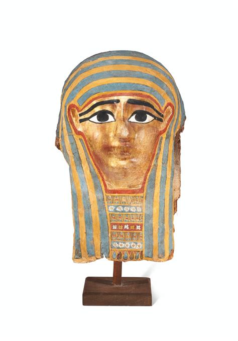 An Egyptian Gilt Cartonnage Mummy Mask
