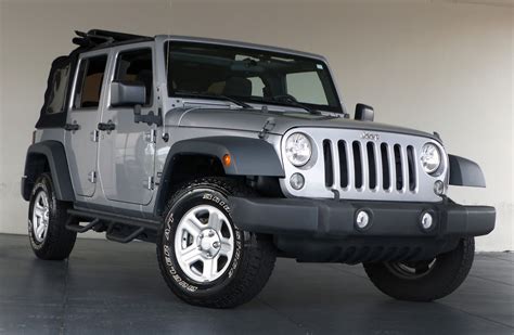 The interior is mostly plastic, but it doesn't feel cheap. Used 2015 Jeep Wrangler Unlimited Sport | Marietta, GA