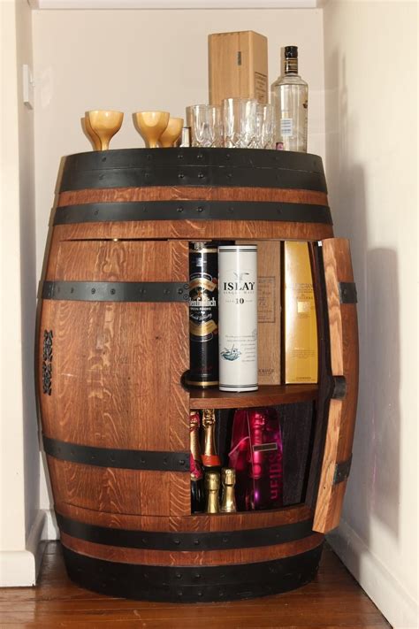 They can lend atmosphere to a home recreation center or to a commercial establishment. Wine barrel drinks cabinet https://www.facebook.com ...