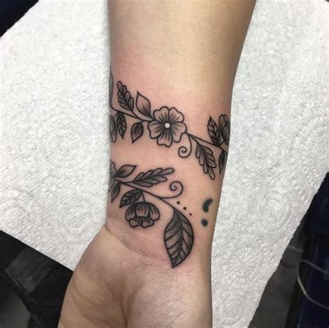 floral vine wrist tattoo by tania leah wrist tattoos cuff tattoo wrist tattoos for women