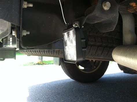 It puts the electric motor on a shortened driveshaft and the battery charging is made by a socket placed on the rear bumper, not exactly a safe area for it to be. Rear AUX light(s) - Jeep Patriot Forums