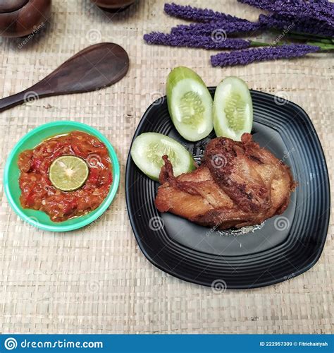 Indonesian Food Fried Chicken With Sambal And Fresh Vegetables Stock