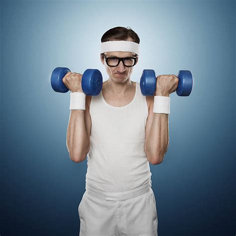 Funny Weak Man Holding Dumbbells Stock Photos Pictures And Royalty Free
