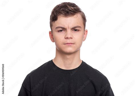 Emotional Portrait Of Upset And Angry Teen Boy Isolated On White