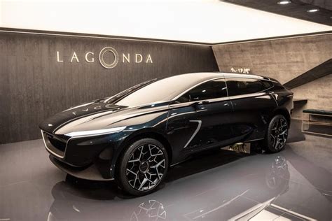 A Black Car Is On Display At The Lagonda Showroom