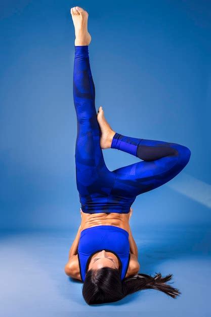 Premium Photo Female Yoga Instructor Performing Floor Exercises