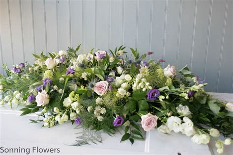 The blanket of flowers that covers the top of the casket, these arrangements are primarily sent by the spouse or immediate family. Casket Sprays - Funeral Flowers - Sonning Flowers
