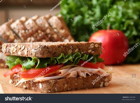 Healthy Sandwich Made With Whole Grain Bread Lettuce Tomato Cheese And Roasted Turkey Slices
