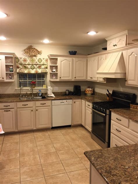 It always helps to paint a small section of the wall beforehand to see how the color meshes changes over the course of a day. Gray with cream cabinets?