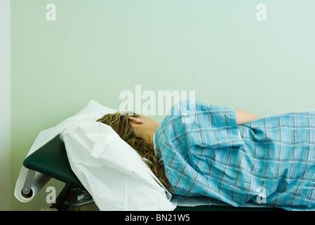 Female Patient Lying On A Table Undergoing Surgery Stock Photo