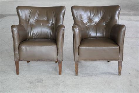 Brown leather chairs are popular. Small-Scale Leather Club Chairs, Danish, Mid-Century For ...